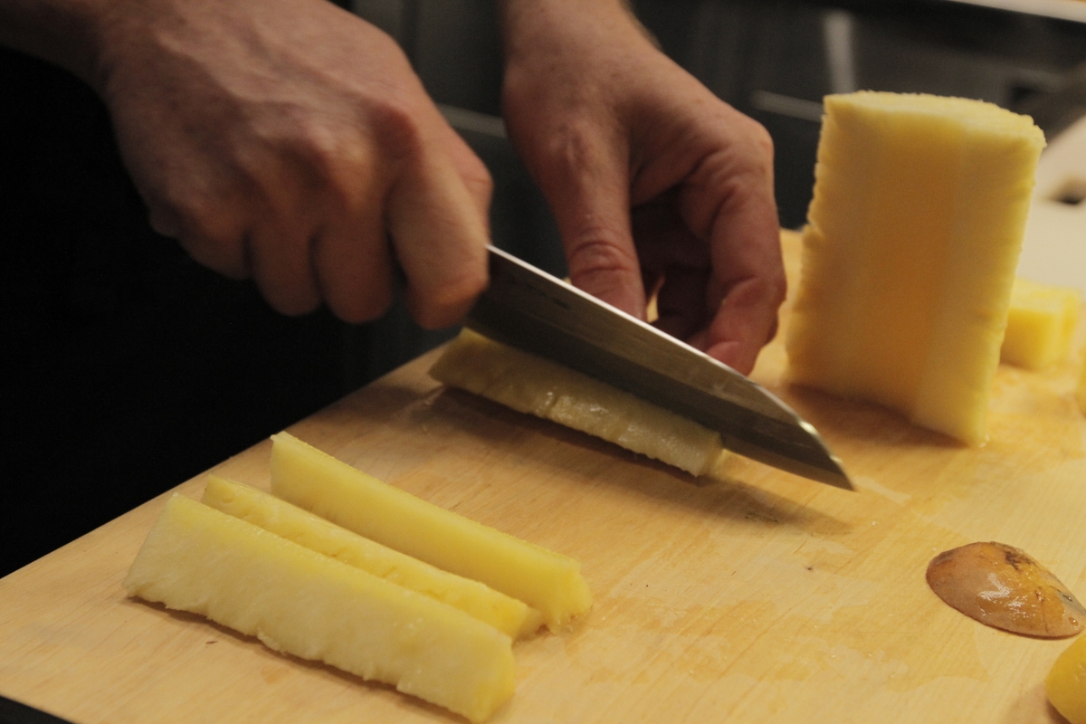 Pineapple being sliced