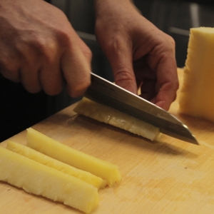 Pineapple being sliced