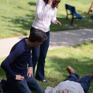 CPR reenactment - woman dials 911
