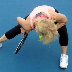 Tennis player stretching muscles