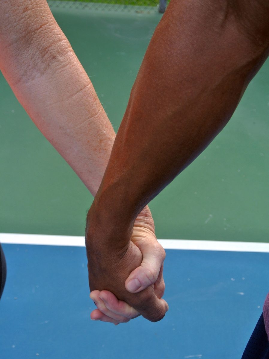 Man and woman holding hands