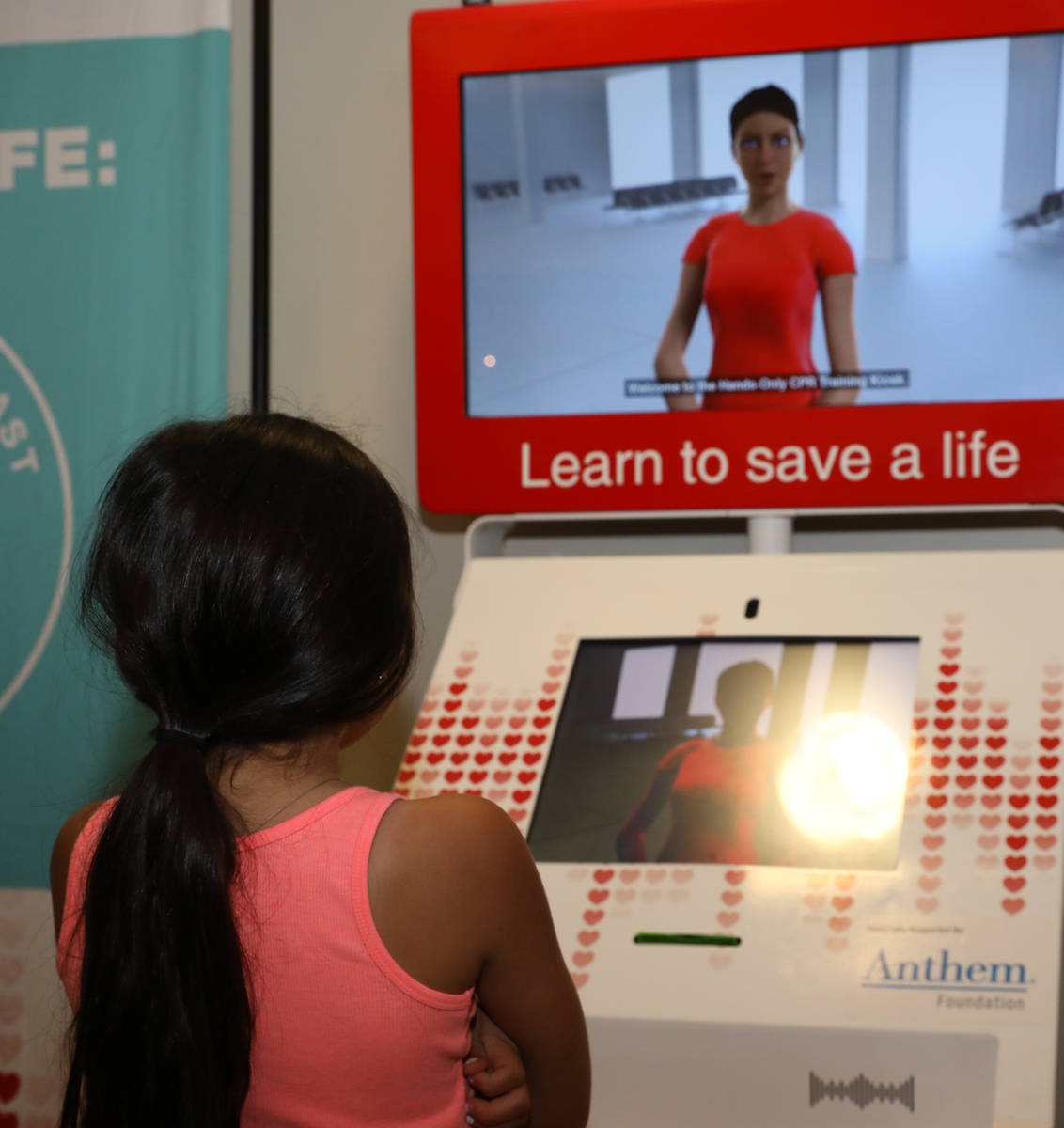 Young girl watching CPR video