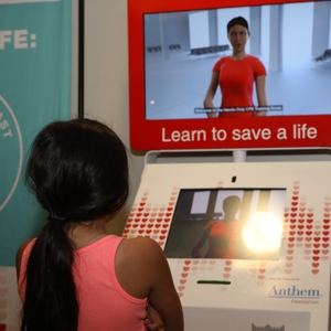 Young girl watching CPR video