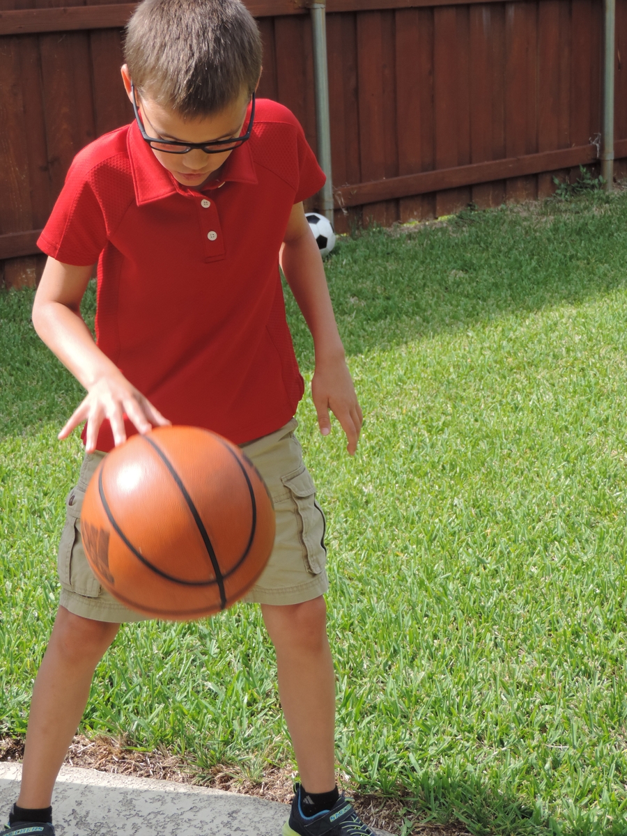 Boy dribbling a basketball