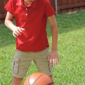 Boy playing with a basketball