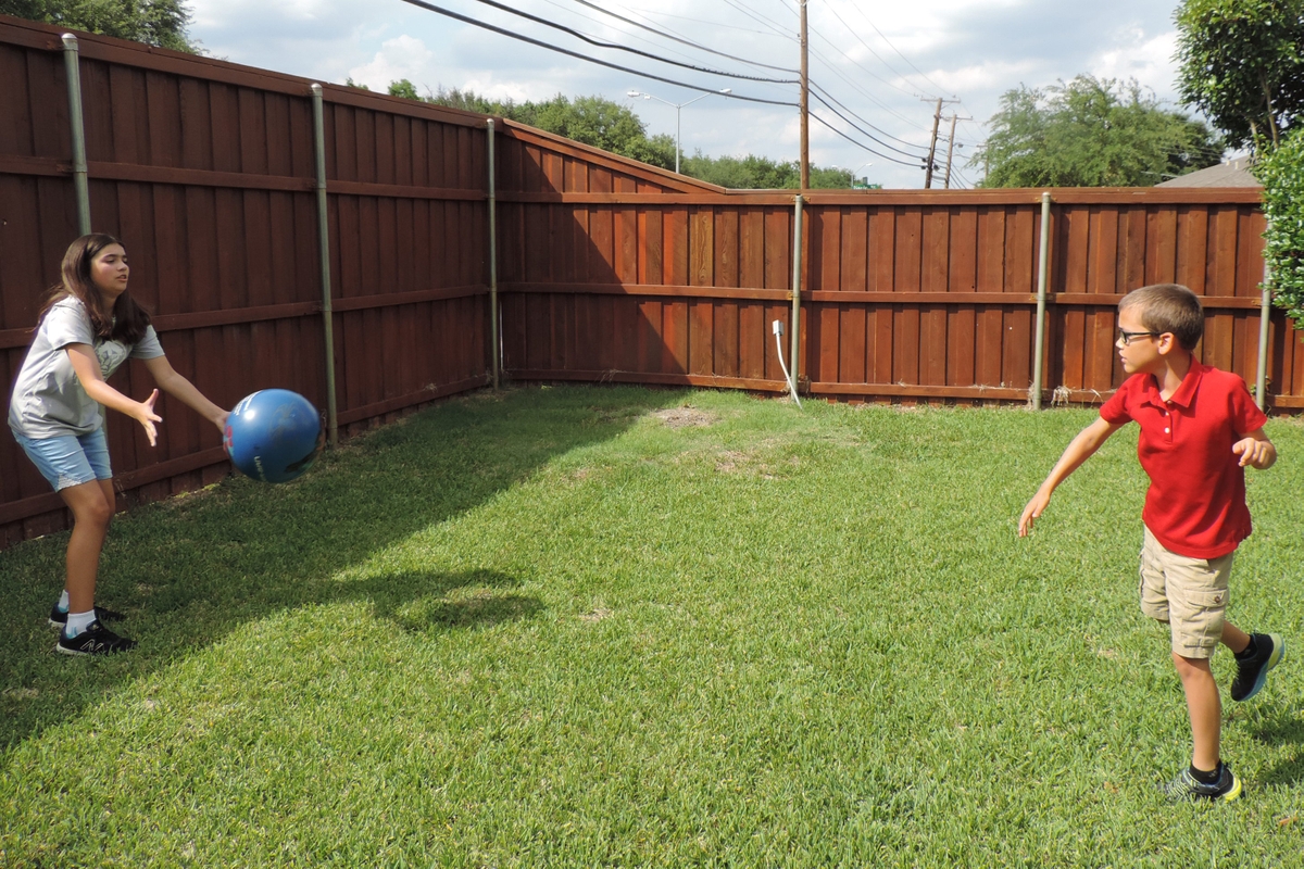 Siblings playing catch