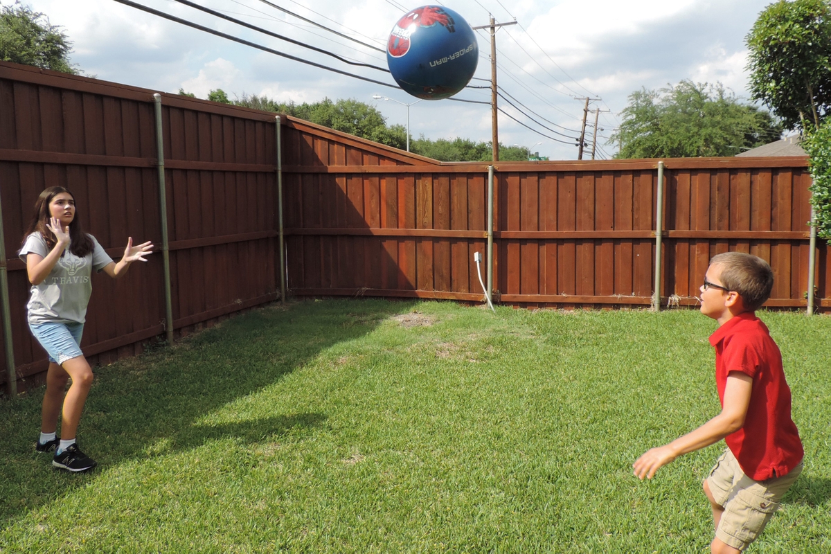 Kids tossing a ball