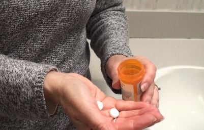 Opioids- woman with pills