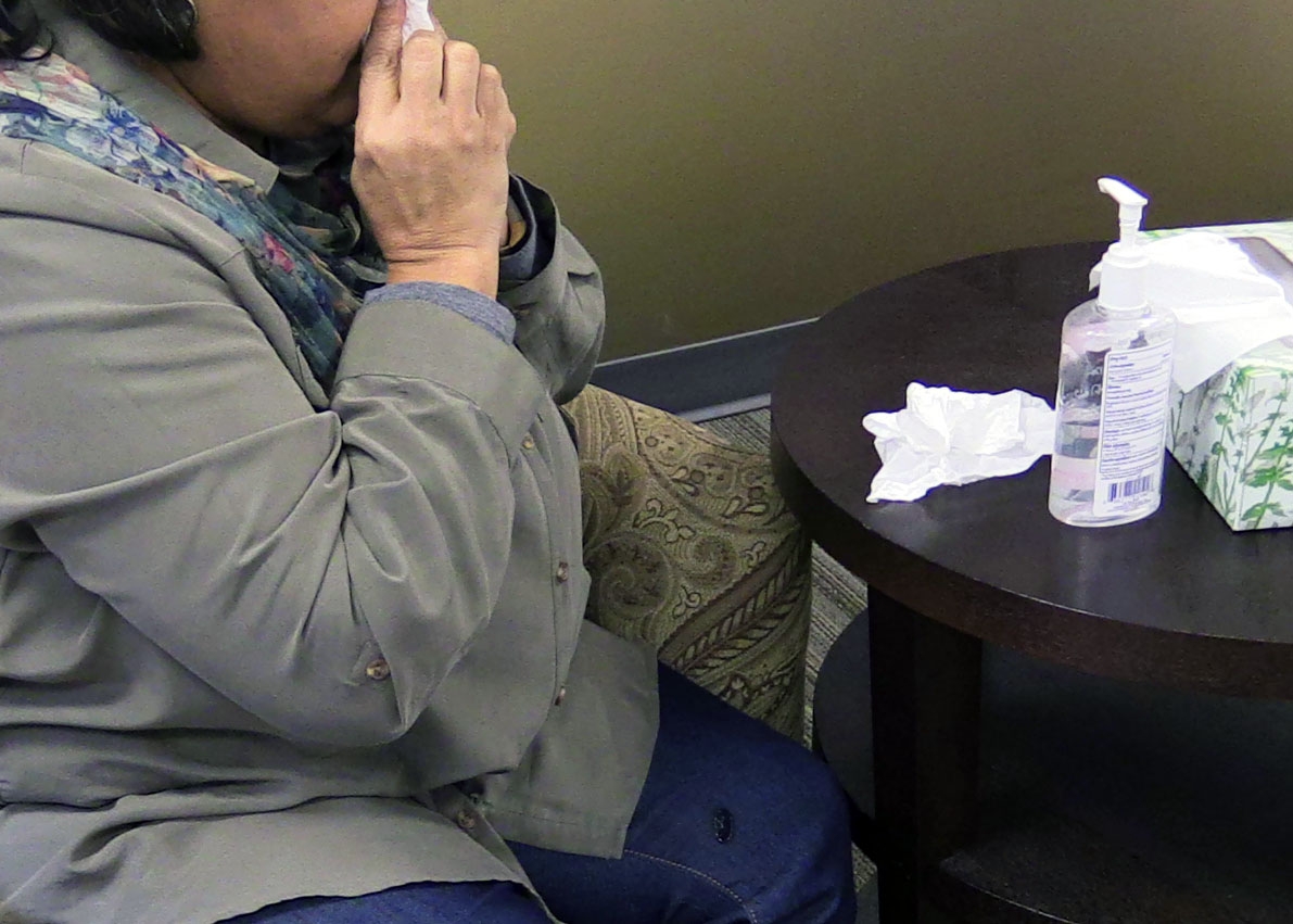 Woman sneezing