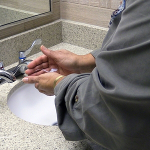 Woman washing hands with soap