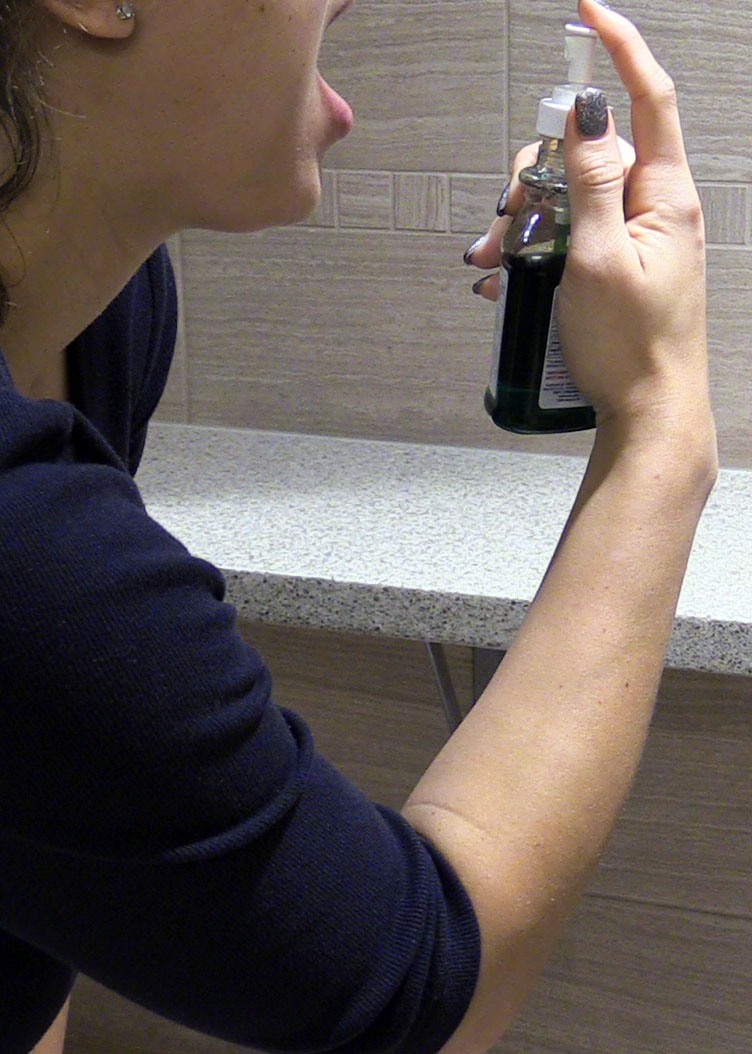 Woman with throat spray