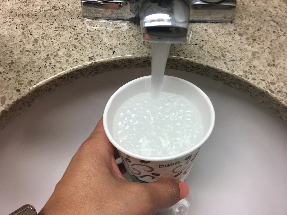 Water pouring into cup