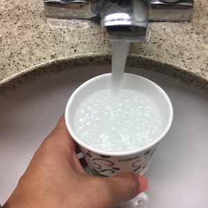 Water pouring into cup