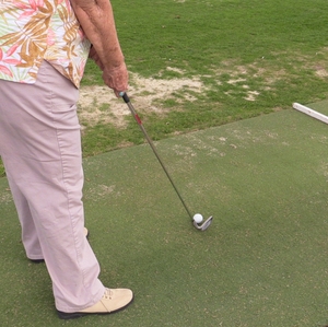 Woman golfing