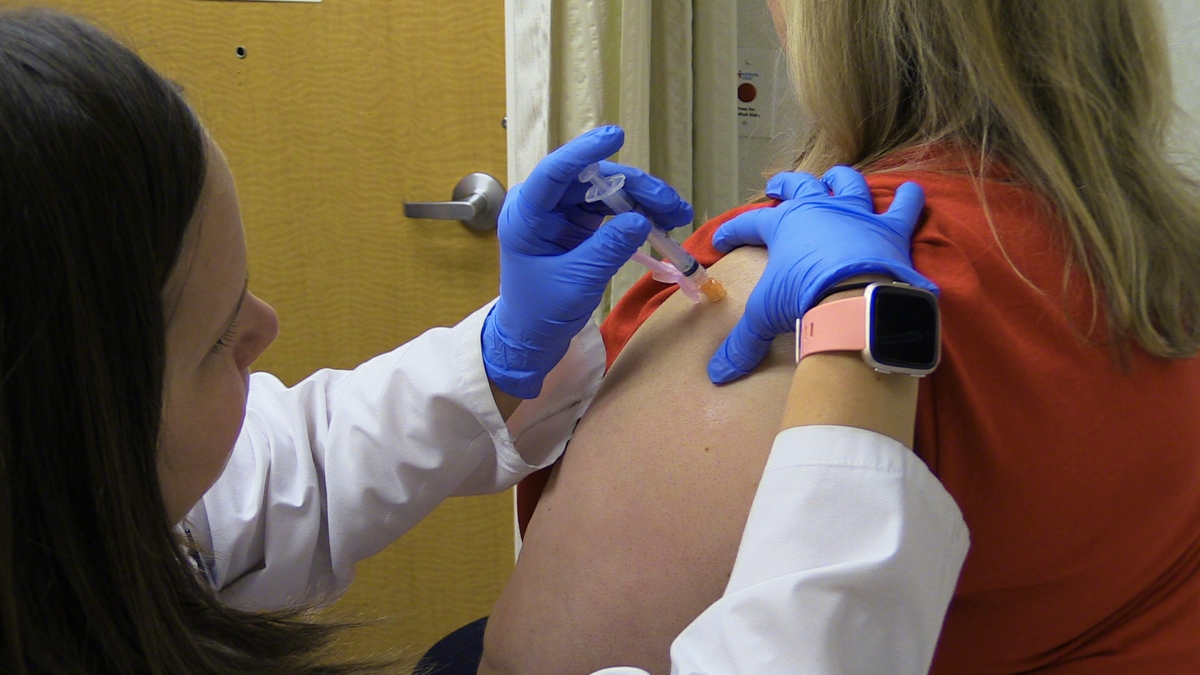 Woman getting shingles vaccine