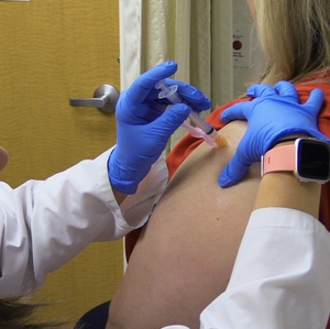 Woman getting shingles vaccine