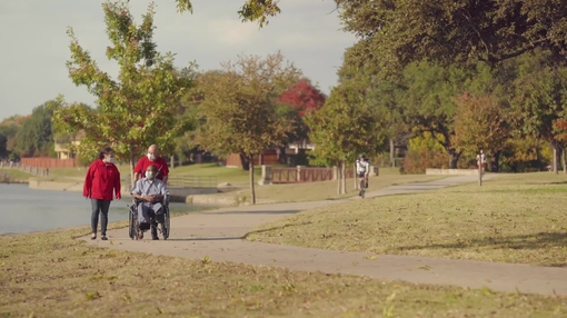 Family with masks on walking