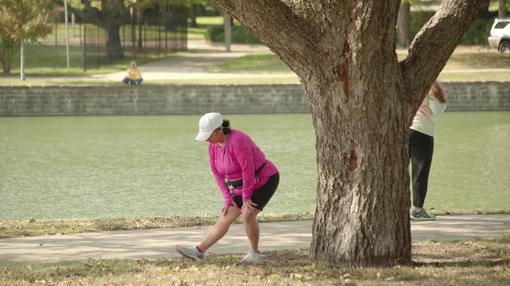 Woman stretching at a park