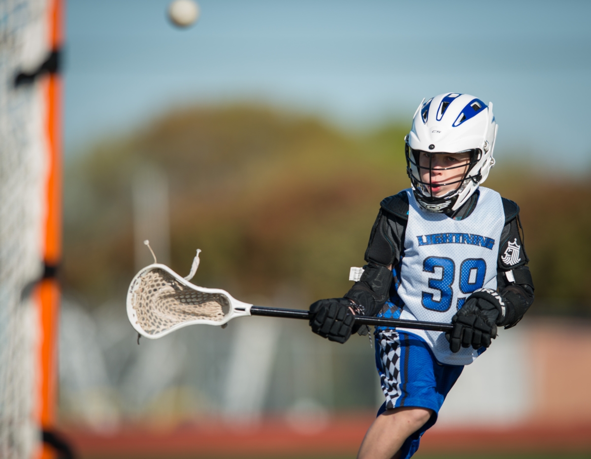 Boy playing Lacrosse