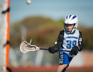 Boy playing Lacrosse