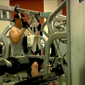 man doing resistance training