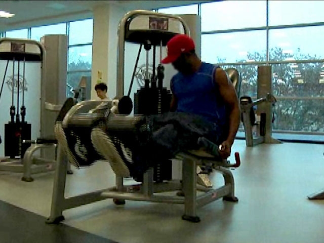man working out with leg weights