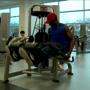 man working out with leg weights