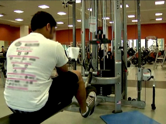 Man on exercise machine at the gym