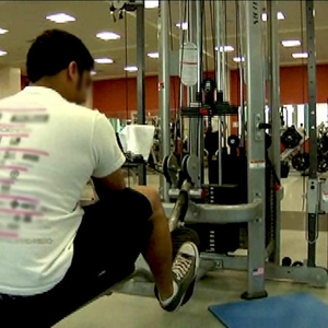 Man on exercise machine at the gym