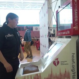 Port of Seattle firefighter using CPR kiosk b-roll