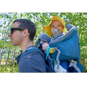 Dad hiking with baby in backpack