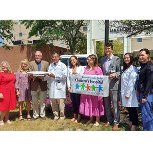 Albany, NY area family honors their son with presentation of scales for at-risk infants 