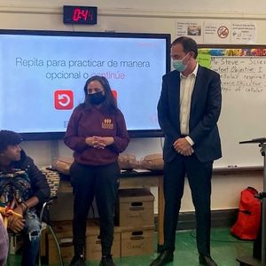 Ms. Milagros Figueroa and David Potack lead Hands-Only CPR class at Crotona International High School