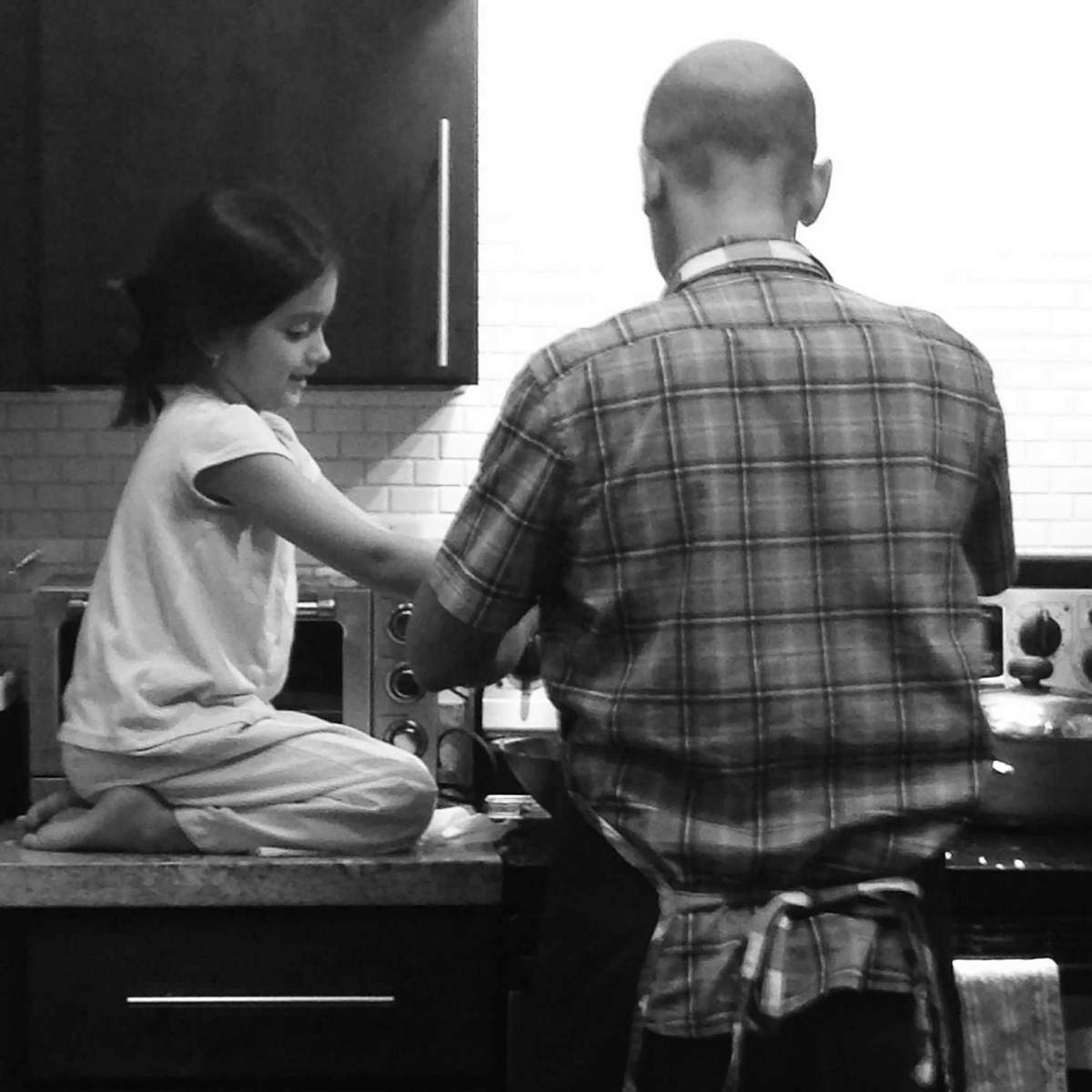 Father and Daughter cooking together