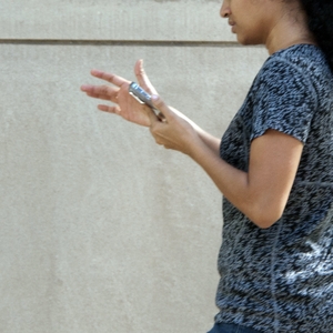 woman walking with cell phone