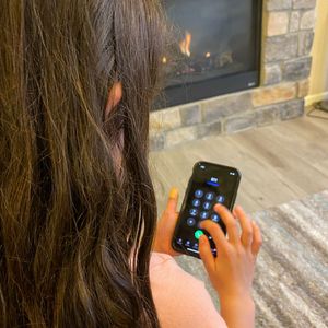 Young girl dialing 911
