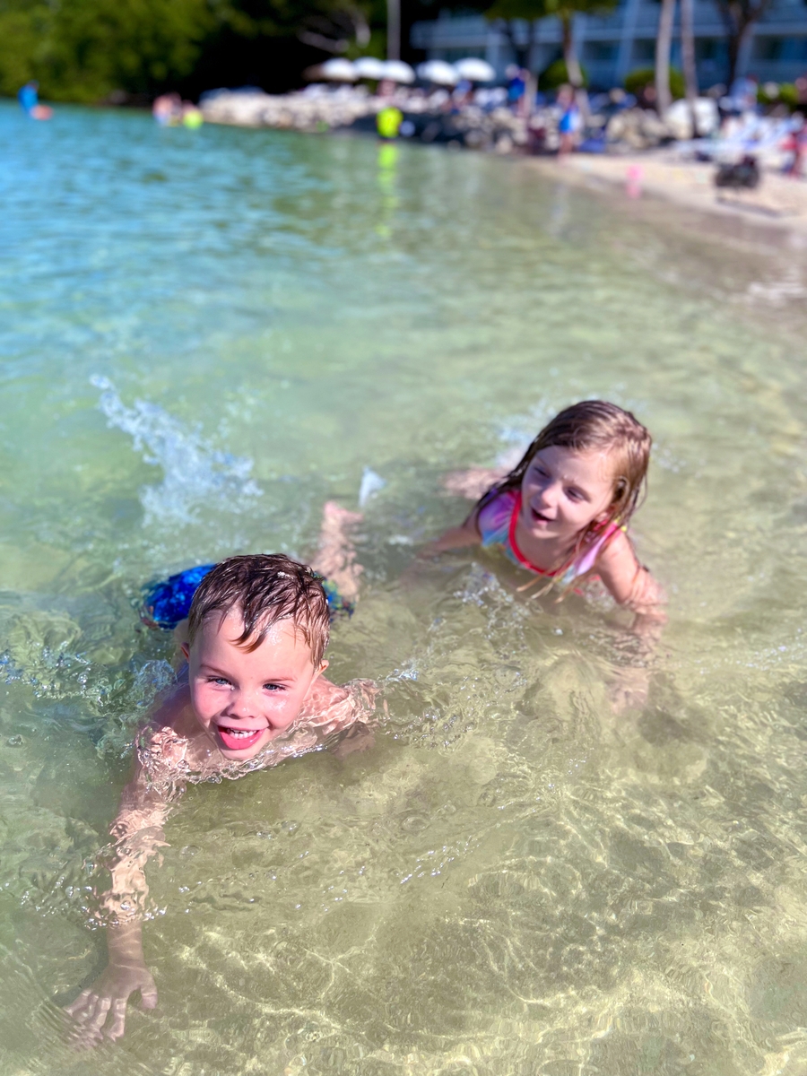 Kids swimming at the beach