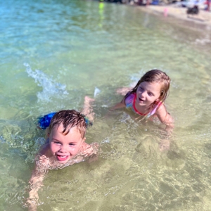 Kids swimming at the beach