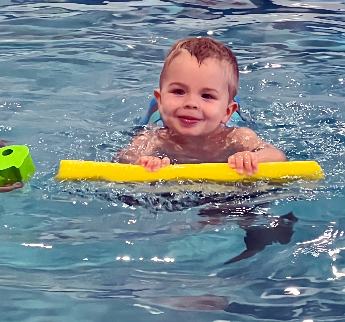 Toddler swimming with float device