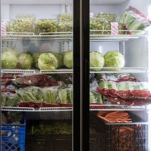 Fridge with produce in food bank