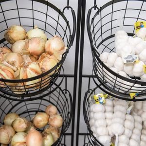 Onions and garlic in baskets
