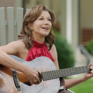 Singer-Songwriter, Amy Grant Playing Guitar