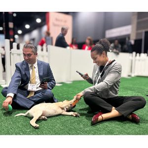 SS24 Attendees in puppy snuggle zone