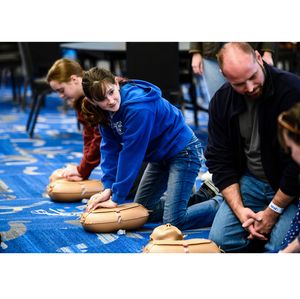 Participants practice Hands-Only CPR