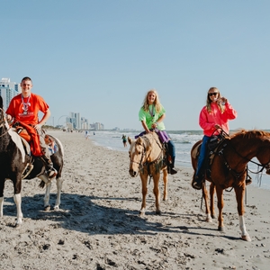 Myrtle Beach - Beach Ride - Participants celebrate after finishing 20-mile ride