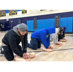 Learning CPR at LA Rams event
