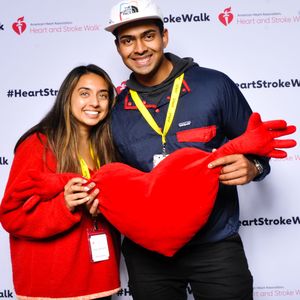 Couple poses in the 2023 Puget Sound Heart and Stroke Walk photo moment 