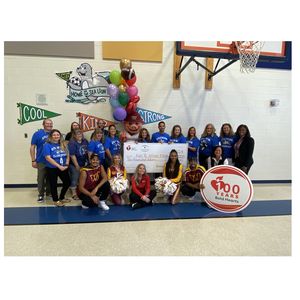 Kyle R. Wilson Elementary School faculty and team with award check