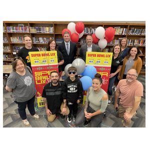 Student ticket winner celebrates with group