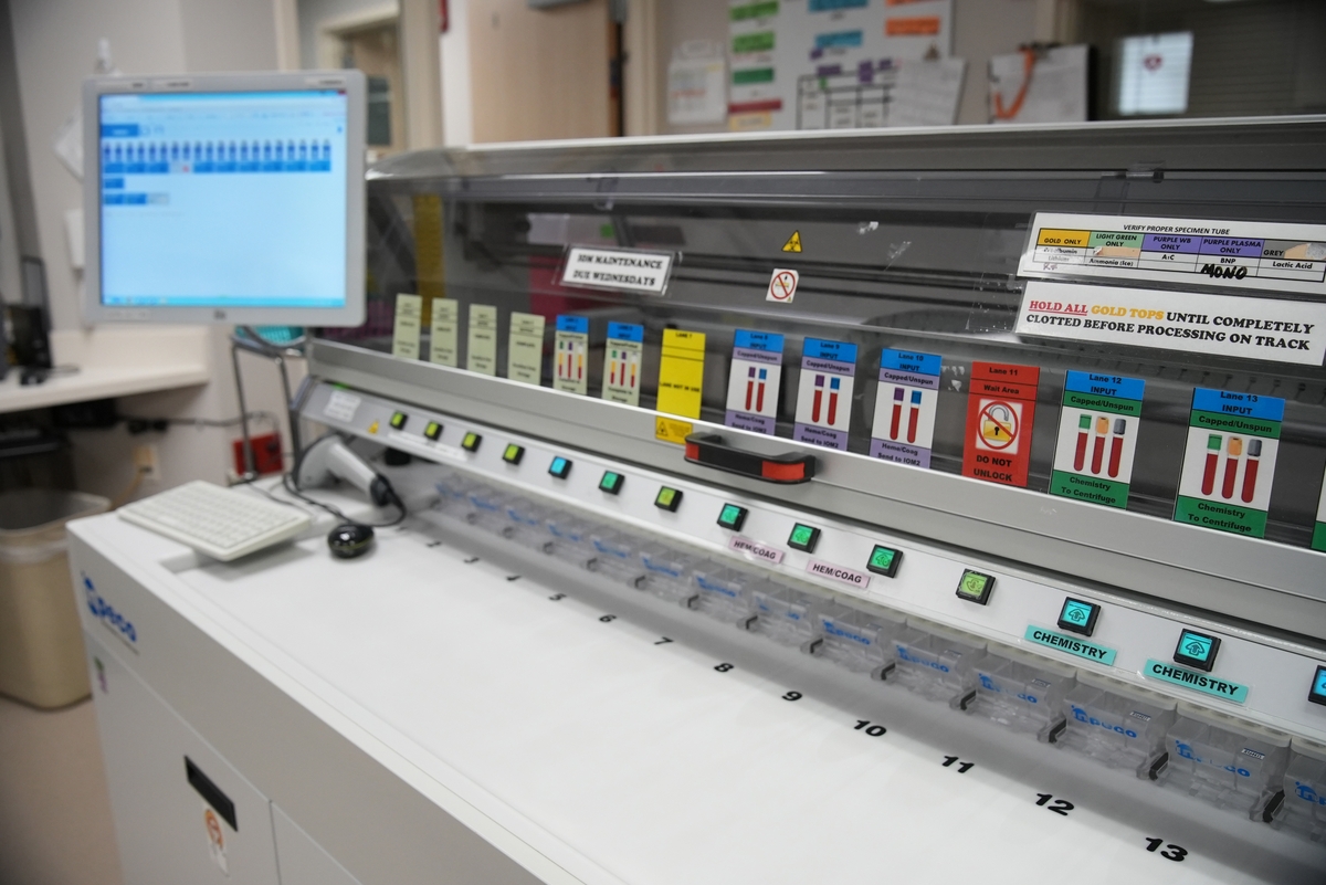 Lab sample processing area with monitor